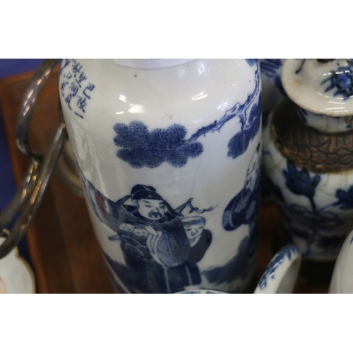 104 - A Chinese blue and white cylindrical vase, decorated figures, six character mark to base, 10