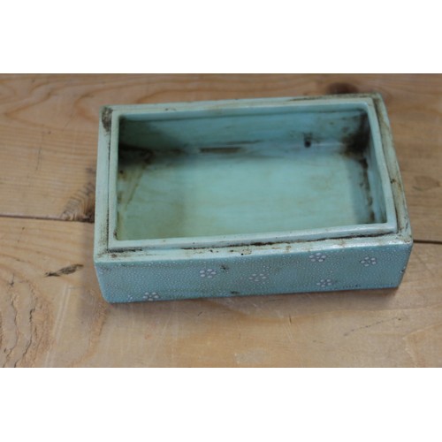 109 - A Chinese porcelain box and cover with verse and textured light green glaze, 4 3/4