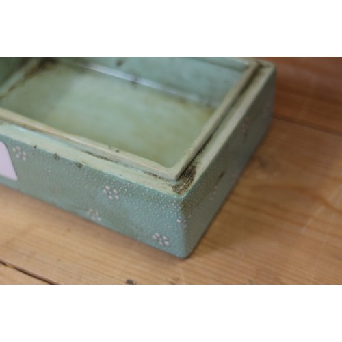 109 - A Chinese porcelain box and cover with verse and textured light green glaze, 4 3/4