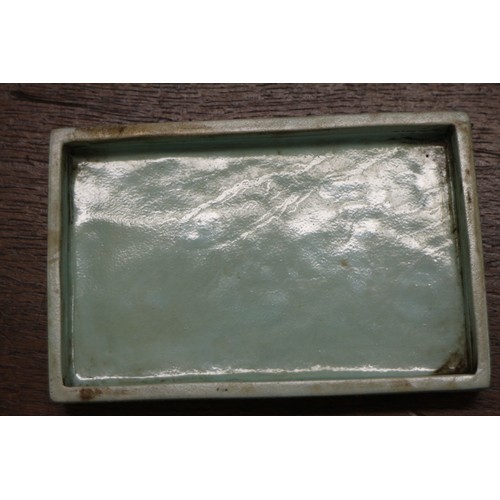 109 - A Chinese porcelain box and cover with verse and textured light green glaze, 4 3/4