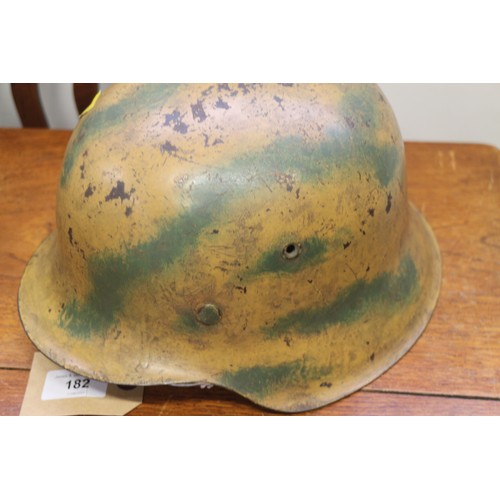 182 - An M42 camouflage helmet