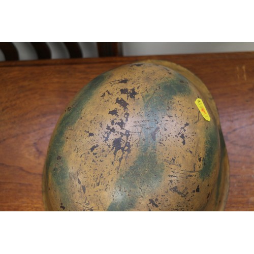 182 - An M42 camouflage helmet