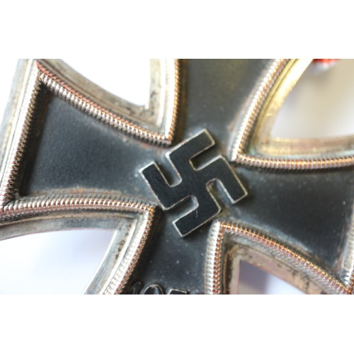 358 - A Knight's Cross of the Iron Cross medal, in case, a white cigarette case, stamped 900 and engraved ... 