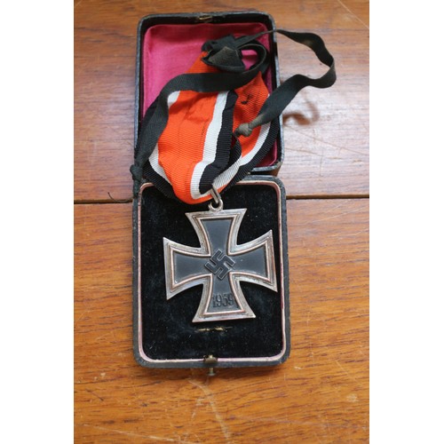 358 - A Knight's Cross of the Iron Cross medal, in case, a white cigarette case, stamped 900 and engraved ... 