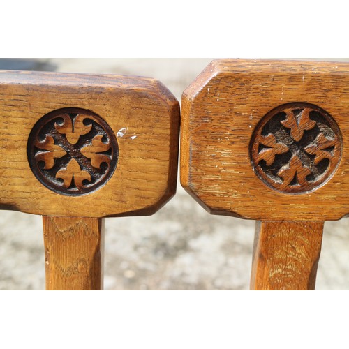 519 - A matched set of twelve mid Victorian carved oak  bar back dining chairs designed by AWN Pugin and m... 