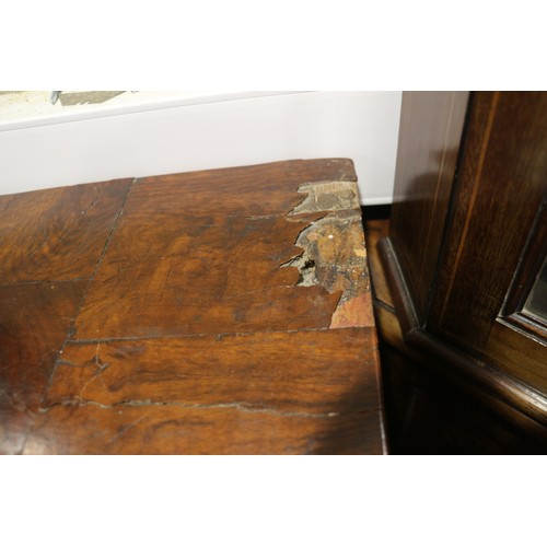 515 - An early 18th century figured walnut and inlaid chest of two short and three long drawers, on bracke... 