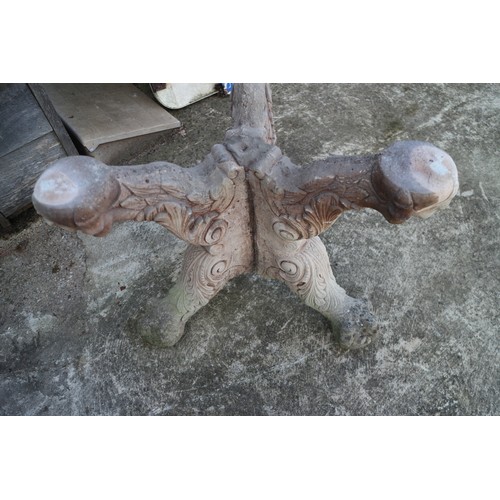 713 - A cast stone garden table, on 'X' frame support, 26