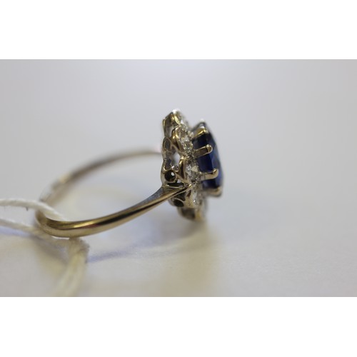 349 - An 18ct gold, platinum, diamond and blue stone cluster ring, size M/N, 3.2g