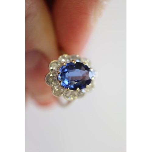 349 - An 18ct gold, platinum, diamond and blue stone cluster ring, size M/N, 3.2g