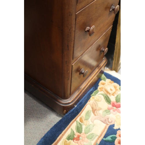 620 - An Edwards & Roberts walnut inverse breakfront double pedestal desk, fitted nine drawers, on block b... 