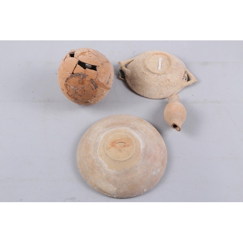 4 - A Roman pottery oil jar, two similar shallow dishes and one other piece of Roman pottery