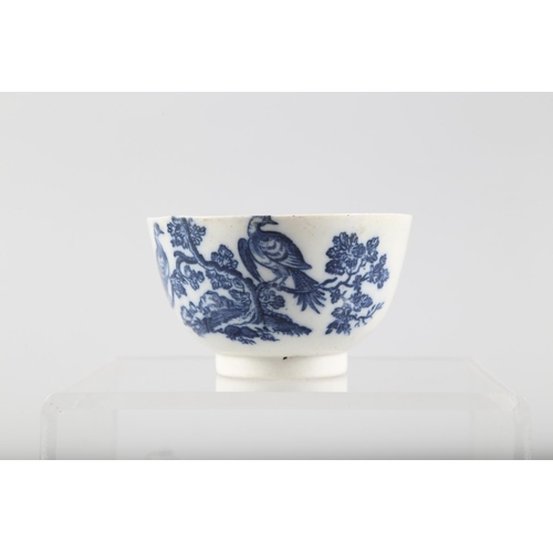 7 - A late 18th century Caughley blue and white bird decorated tea bowl, a Coalport style candlestick sn... 