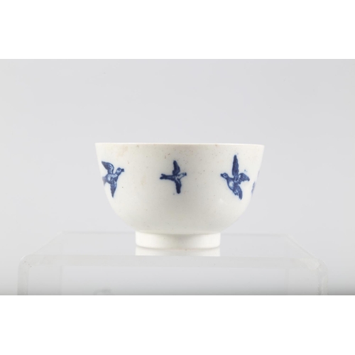 7 - A late 18th century Caughley blue and white bird decorated tea bowl, a Coalport style candlestick sn... 