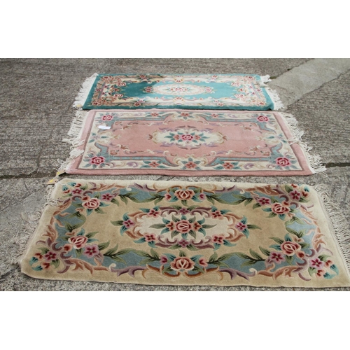 745 - Three Chinese contour pile wool rugs, various designs, largest 36