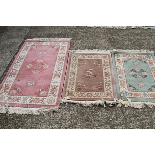 746 - Two Chinese contour pile wool rugs with character borders and a larger similar rug, largest 31