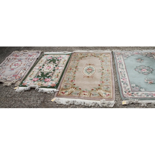 747 - Four Chinese contour pile wool rugs with floral designs, largest 31 1/2