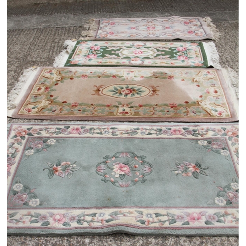 747 - Four Chinese contour pile wool rugs with floral designs, largest 31 1/2