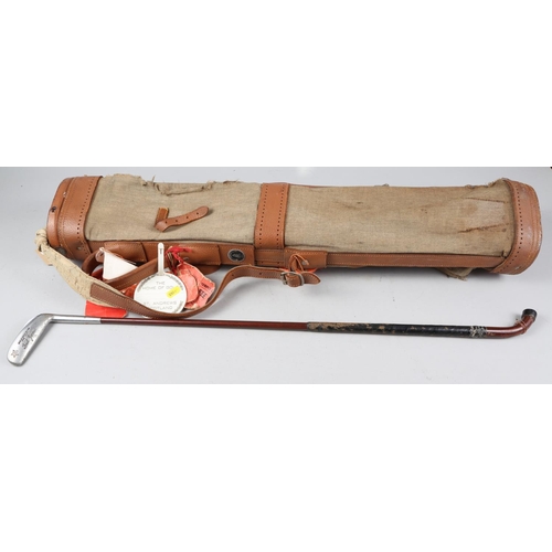 751 - A golf bag with Old Course St Andrew tag and Fred Jarman putter