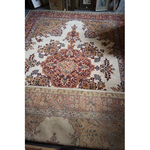 748 - A wool pile rug of traditional Persian design in shades of brown, tan, blue and natural, 49