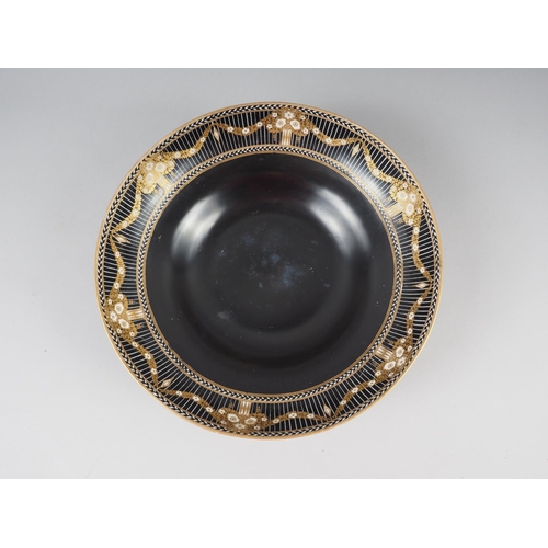 64 - A Royal Worcester china shallow fruit bowl, decorated in black and gilt, and a black decorated eggsh... 