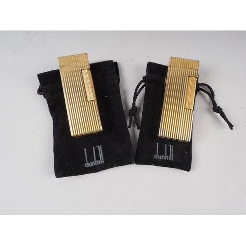 205 - Two gold plated Dunhill butane cigarette lighters with original velvet pouches