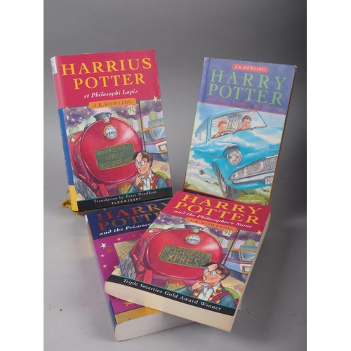 246 - J K Rowling: Harrius Potter et Philosphi Lapis, Latin text, hardback with dust cover and three other... 