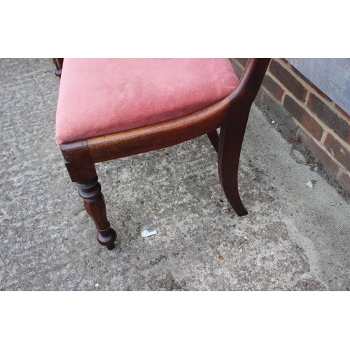 540 - A pair of Victorian mahogany loop back dining chairs with stuffed over seats, on faceted supports
CO... 