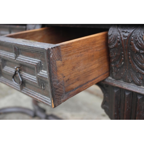 541 - A 19th century Continental carved oak side table, fitted three drawers, on turned supports united by... 