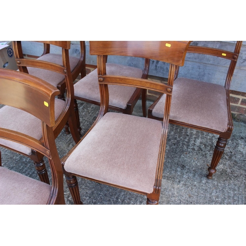 543 - A set of six Regency style mahogany bar back dining chairs with drop-in seats, upholstered in a ligh... 