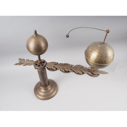 128 - A patinated brass hand-operated sun, earth and moon orrery, 18