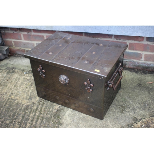 158 - A copper kindling box with fleur-de-lys and studded effect decoration, 20 1/2