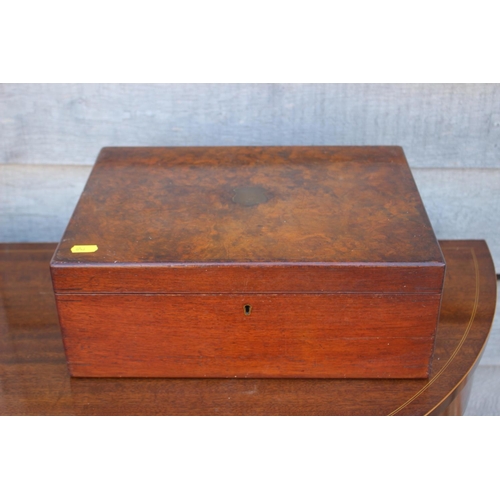 172 - A burr walnut sewing box, containing sewing supplies, including a darning dolly, thread, needles etc... 