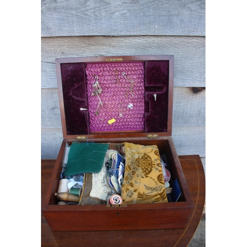 172 - A burr walnut sewing box, containing sewing supplies, including a darning dolly, thread, needles etc... 