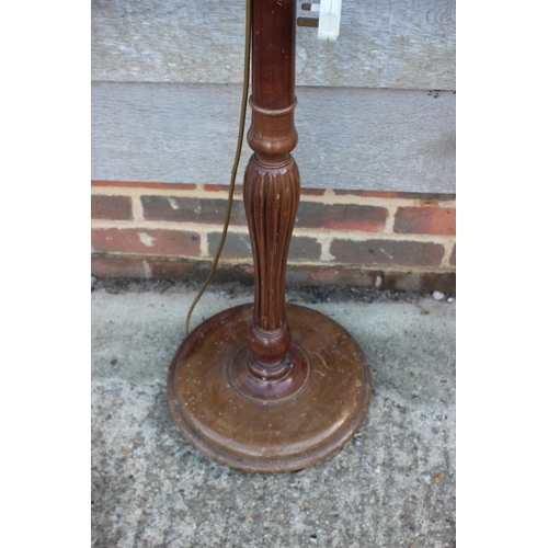 236 - A mahogany standard lamp, on turned column and circular base, 60 1/2