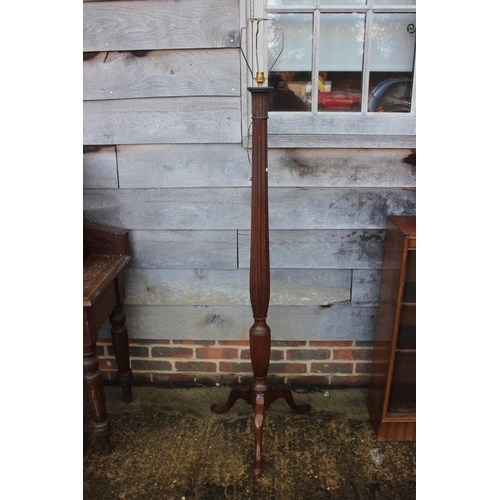 241 - An early 20th century turned and fluted mahogany standard lamp