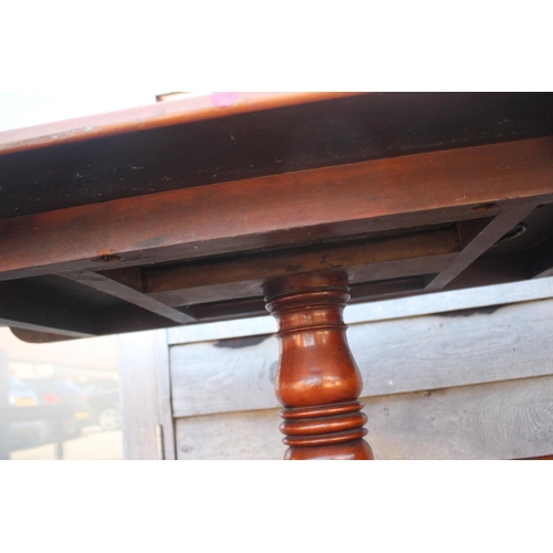 520 - A 19th century mahogany rectangular tilt top breakfast table, on tuned column and quadruple splay su... 