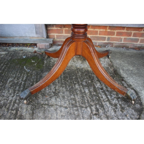 520 - A 19th century mahogany rectangular tilt top breakfast table, on tuned column and quadruple splay su... 