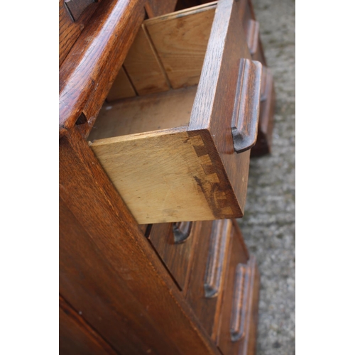 521 - A 19th century oak roll top desk with fitted interior over nine drawers with slides, block base, 42