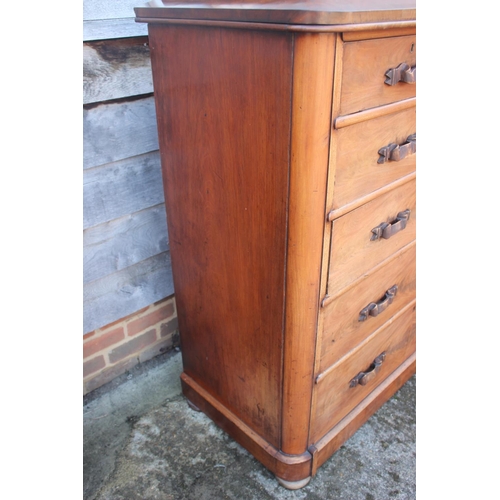 522 - A 19th century figured mahogany chest of two short and four long graduated drawers with carved ribbo... 