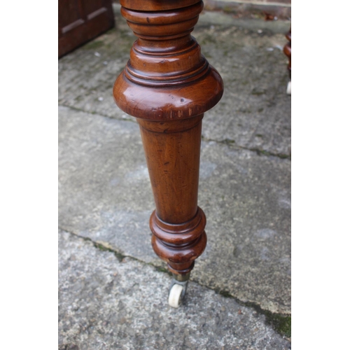 529 - A mid 19th century mahogany extending dining table with two extra leaves, on turned and castored sup... 