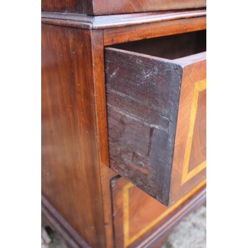 533 - A Georgian figured mahogany and satinwood banded bookcase enclosed two doors over two short and one ... 