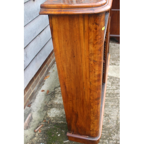 534 - A Victorian figured walnut open bookcase, fitted adjustable shelves, on block base, 56