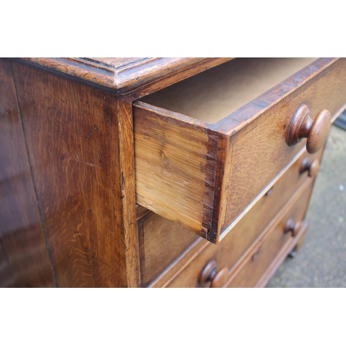 547 - An 18th century oak chest of four long drawers with later knob handles, on bracket feet, 37