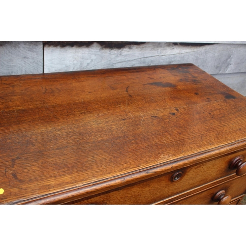 547 - An 18th century oak chest of four long drawers with later knob handles, on bracket feet, 37