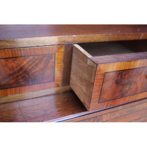 597 - A Continental figured walnut and banded cocktail cabinet, fitted one drawer over cupboard enclosing ... 