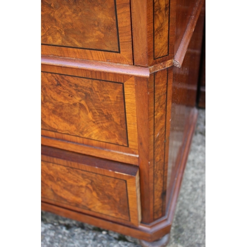 597 - A Continental figured walnut and banded cocktail cabinet, fitted one drawer over cupboard enclosing ... 