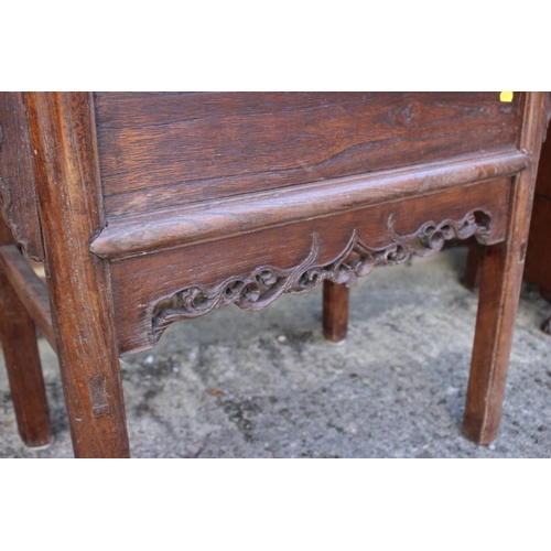 610 - A Chinese carved elm side table, fitted two drawers, on turned supports, 39