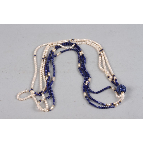 325 - An Oriental lapis lazuli and pearl three-strand necklace