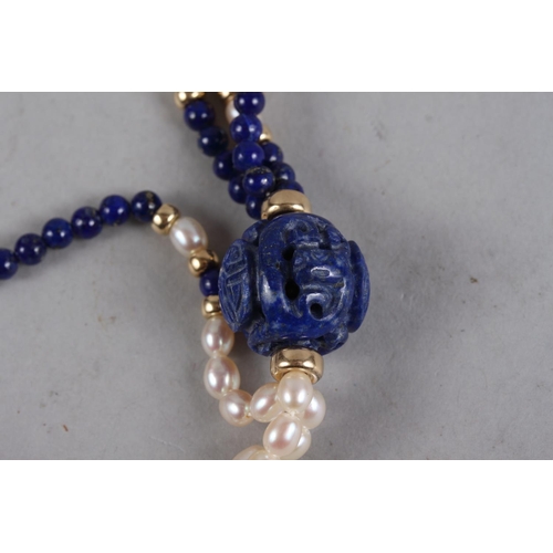 325 - An Oriental lapis lazuli and pearl three-strand necklace