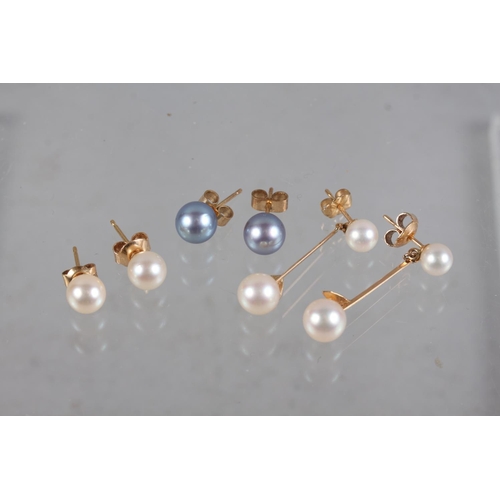 328 - A pair of yellow metal and pearl drop earrings and two pairs of similar ear studs